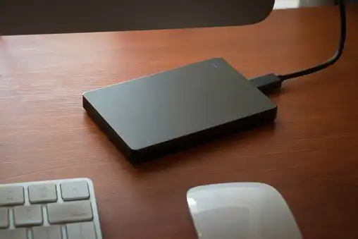 how to clear disk space on mac : A Mobile Backup Hard Drive Sitting On A Desktop